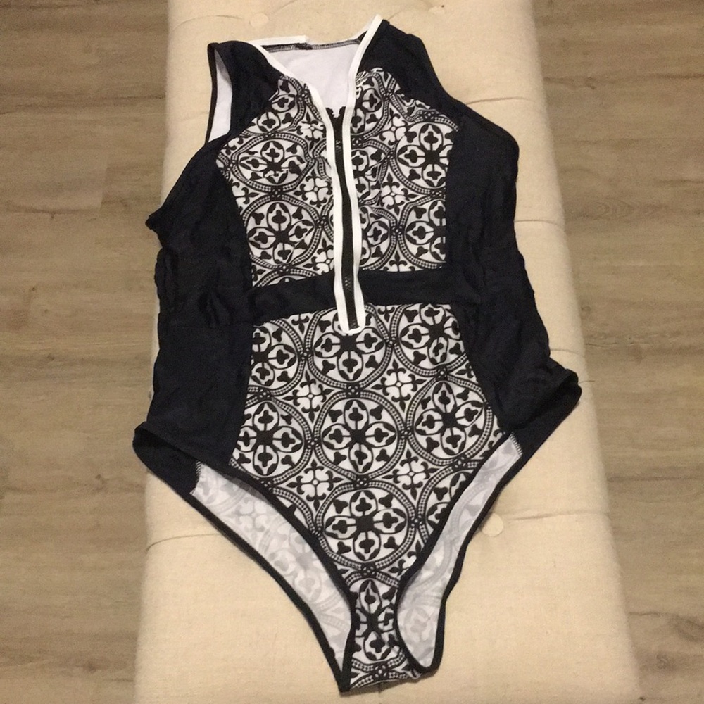 Beautiful Venus one piece swim suit. Never worn!